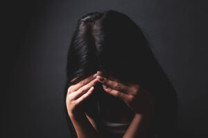 Distressed woman thinking about heroin overdose