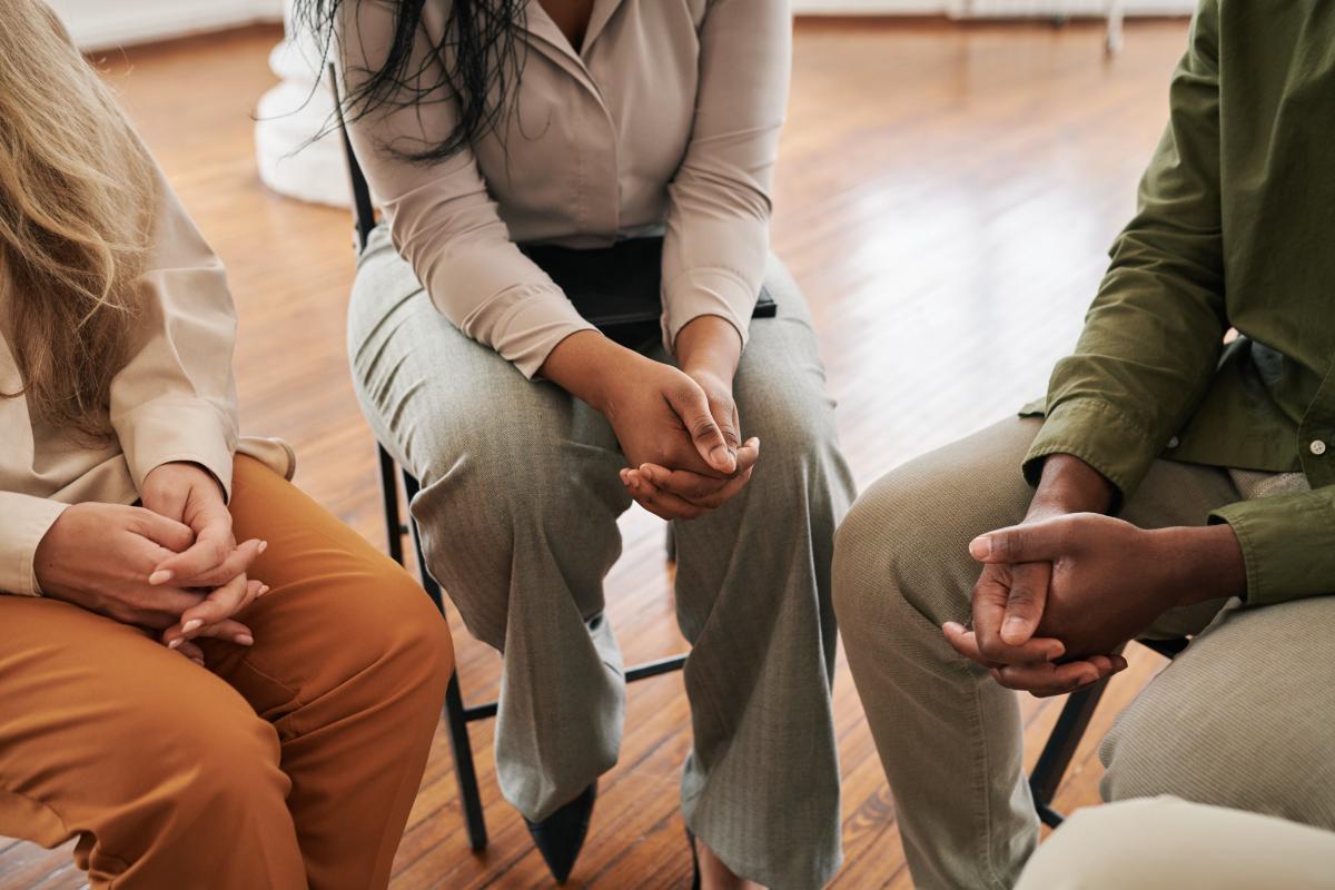 Several people discuss the benefits of group therapy