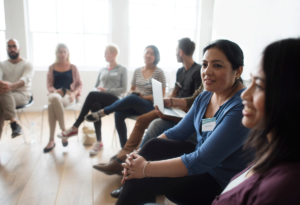 A group of people in group therapy for addiction